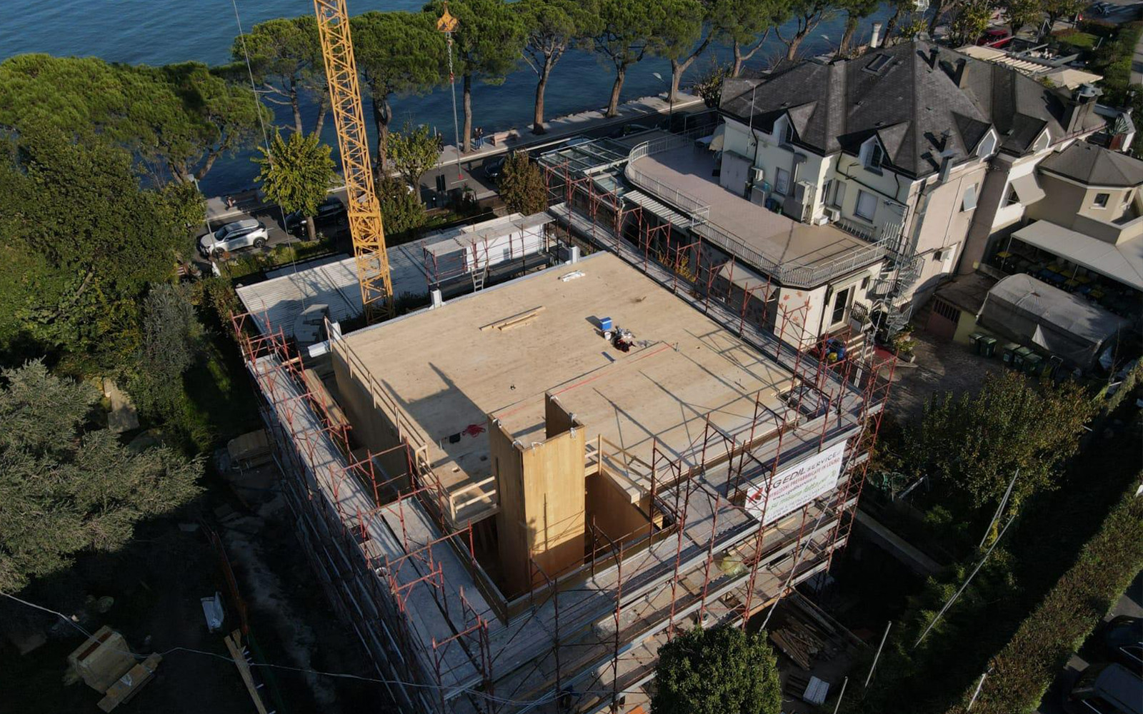 Overview of a multi-story building site with cross-laminated timber elements
